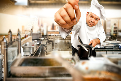 Cook chef in kitchen 