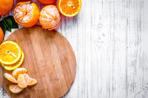 Citrus concept. Oranges and mandarins on wooden table background