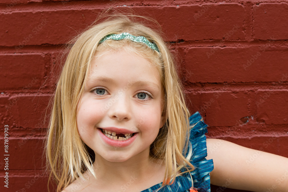 adorable school age girl with missing front baby tooth gap Stock Photo |  Adobe Stock
