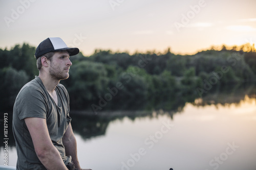 Young man enjoying sunset at Ruhraue photo