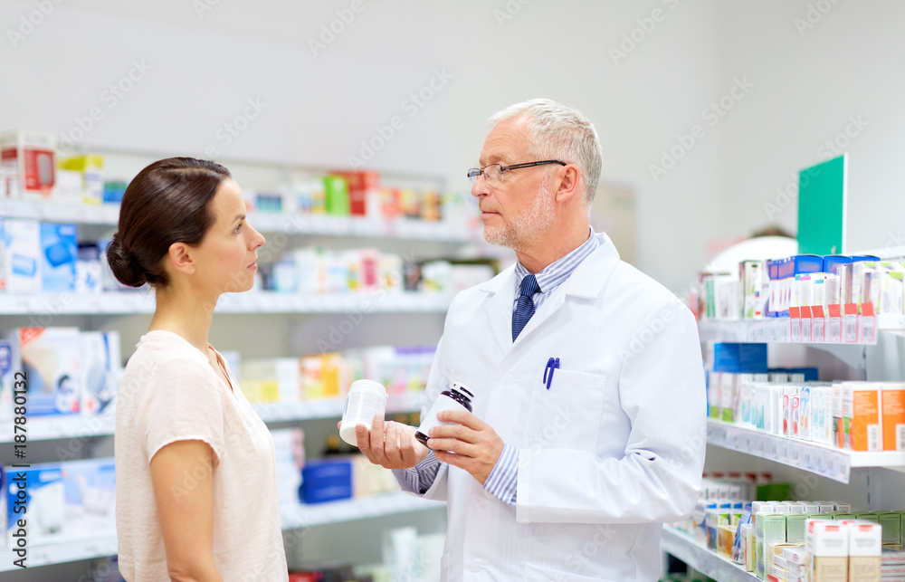 apothecary and woman with drug at pharmacy