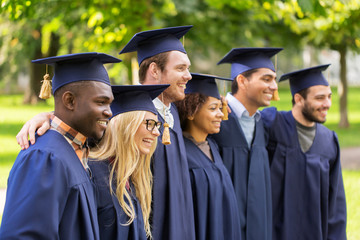 happy students or bachelors in mortar boards