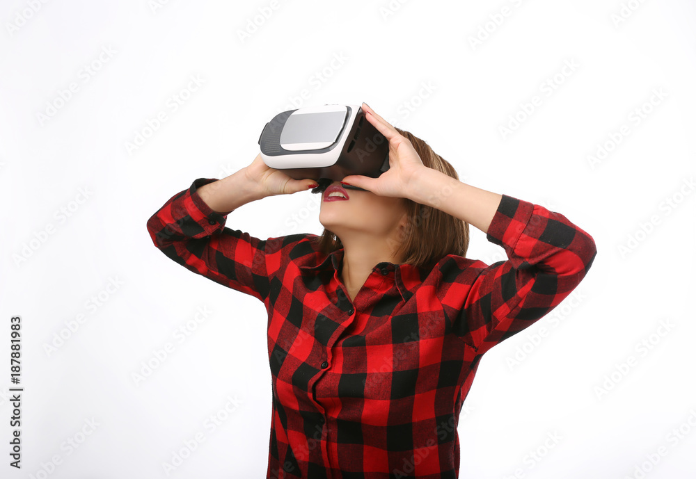 Happy young woman using a virtual reality headset. Future is right now. Isolated portrait Happy young woman using a virtual reality headset. Future is right now. Isolated portrait