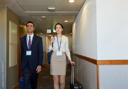 business team with travel bags at hotel corridor