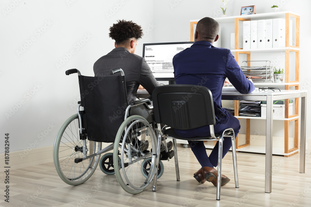 Physically Impaired Businessman With His Partner Working Physically Impaired Businessman With His Partner Working