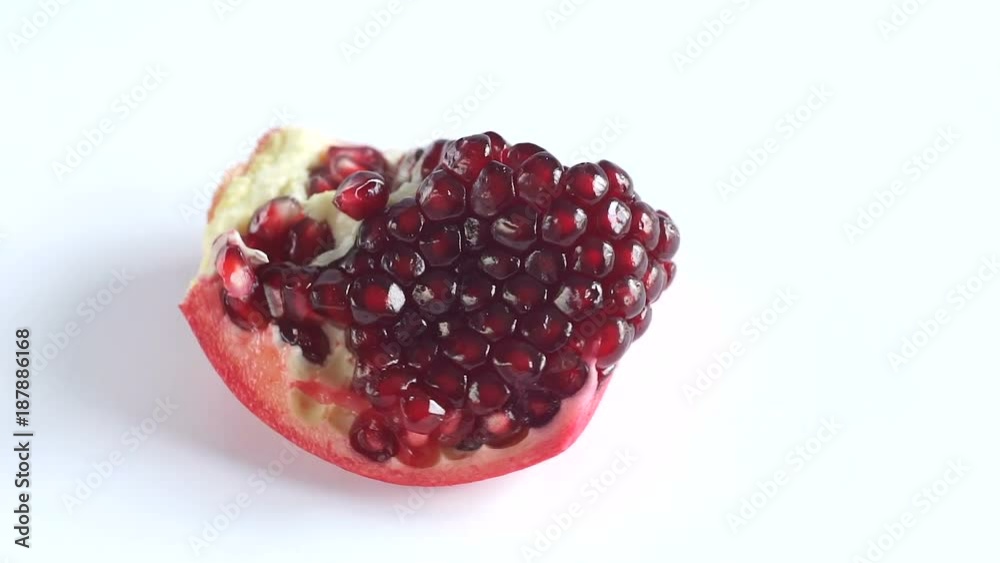 pomegranate rotates on a white background pomegranate rotates on a white background