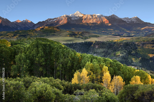 Wilson Peak, foreground aspen trees and rolling hills