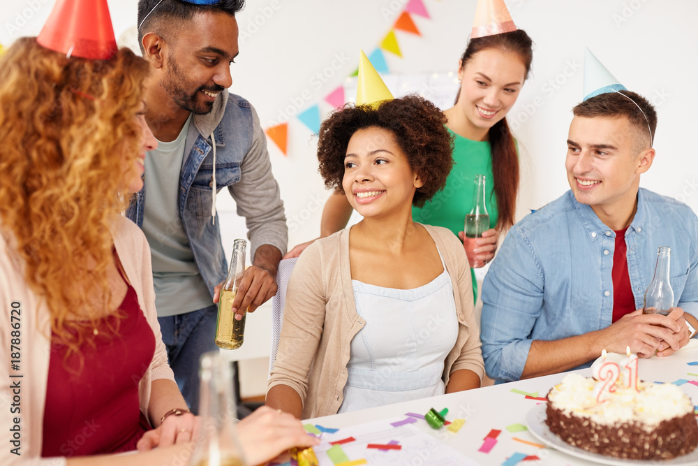 team greeting colleague at office birthday party team greeting colleague at office birthday party