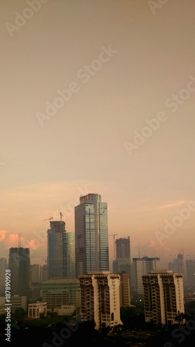 scenery of morning view with skyscraper building in the city © aris