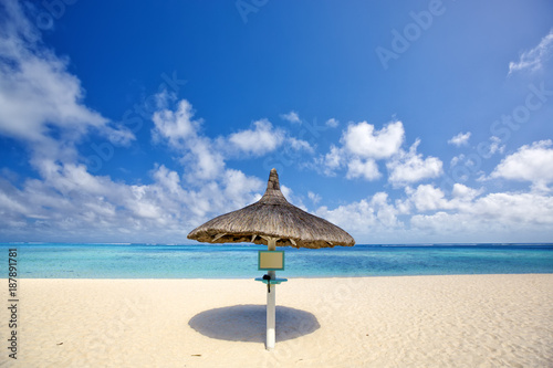 Beach umbrella on sand beach in Mauritius Island