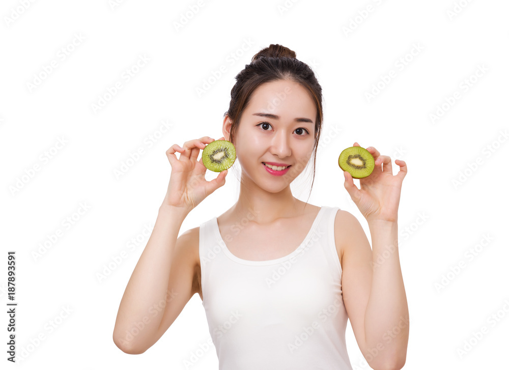 Kiwi is great for health - Healthy fruit funny woman holding kiwi fruit Kiwi is great for health - Healthy fruit funny woman holding kiwi fruit