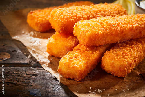 Close up view of crispy fried fish fingers photo