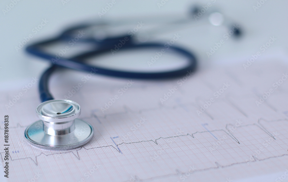 docter workplace with a stethoscope Cardiogram chart with medical table closeup,for heart record docter workplace with a stethoscope Cardiogram chart with medical table closeup,for heart record
