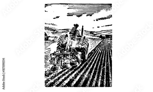 Tractor and plough in a field
