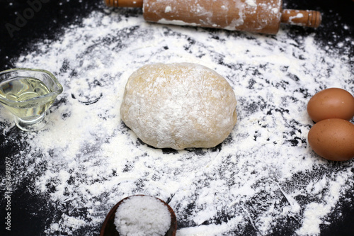 Ingredients for bread making from dough. Flour egg and oil salt photo