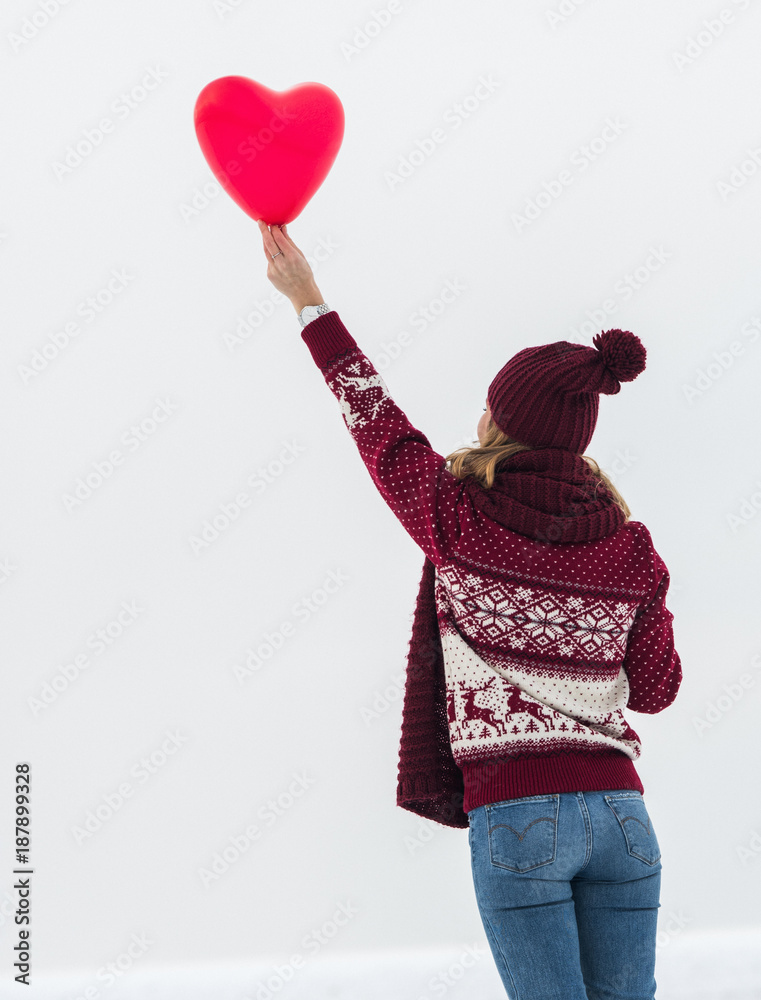 Pretty woman with heart balloon