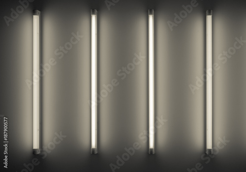 four neon tubes or lamps on the wall