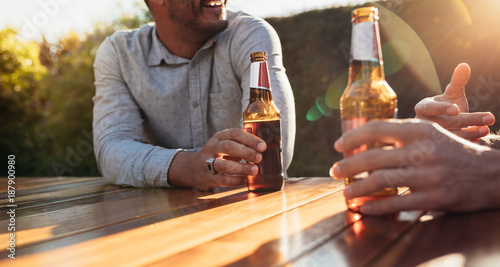 Photography Couple having beers at outdoor party