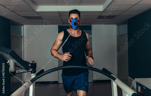 Runner testing his performance in sports science laboratory