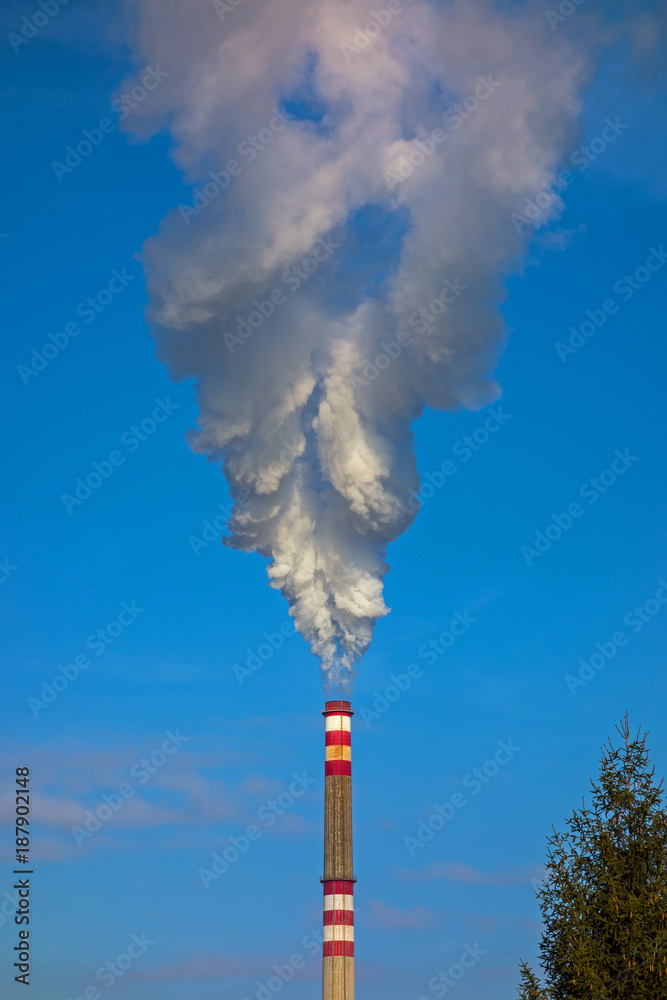 Big white smoke from the factory chimney. The smoke has the form of spirit