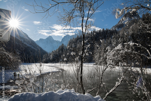 Vászonkép Idyllic winter scenery by river Pisnica in Julian Alps in sunlight and blue sky,