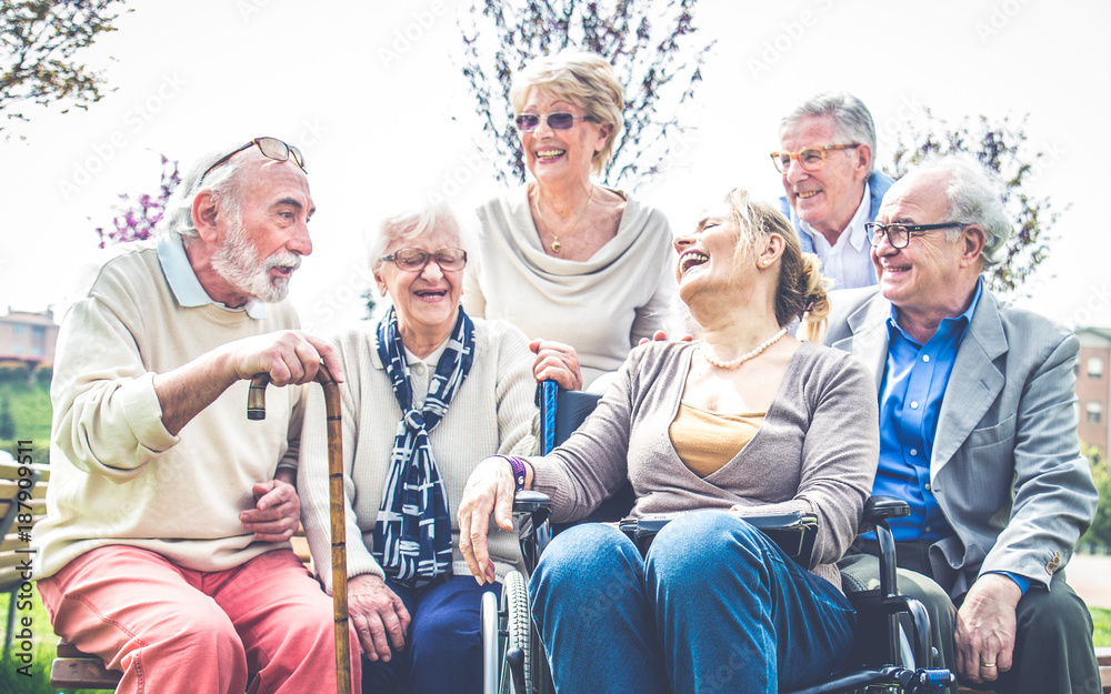 © oneinchpunch - Senior people walking outdoors