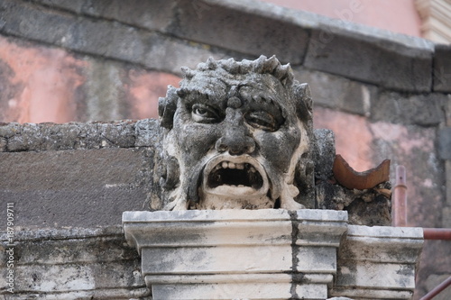 Baroque stone mask, Cathedral of Acireale, Sicily photo