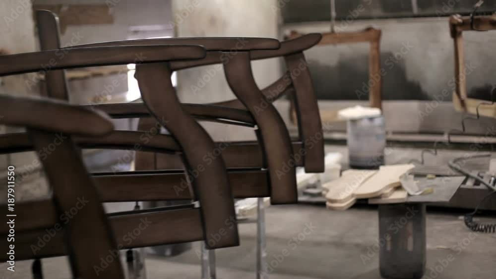 Wooden parts are varnished in the furniture factory. production of upholstered furniture Wooden parts are varnished in the furniture factory. production of upholstered furniture