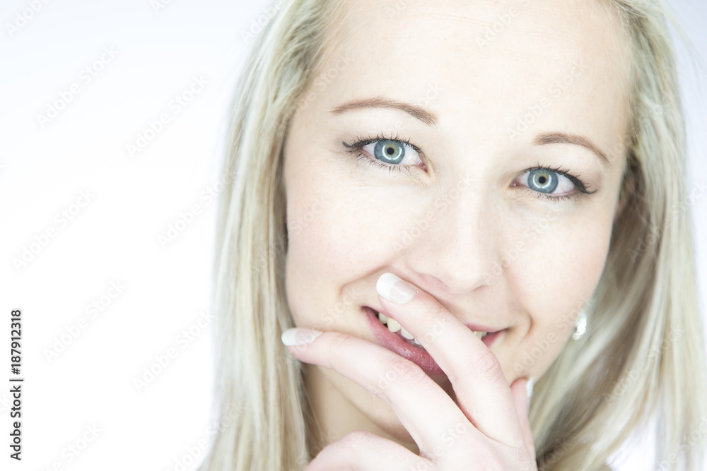 Portrait of an isolated friendly blond woman with blue eyes in artistic conversion Portrait of an isolated friendly blond woman with blue eyes in artistic conversion