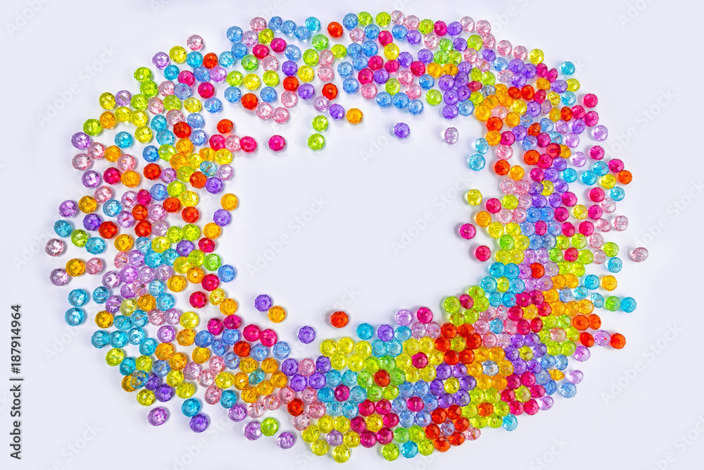 Background of colored beads on a white background