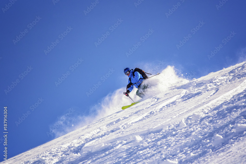 extreme skier on a steep slope extreme skier on a steep slope