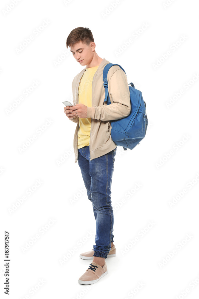 Trendy teenage boy with mobile phone on white background Trendy teenage boy with mobile phone on white background