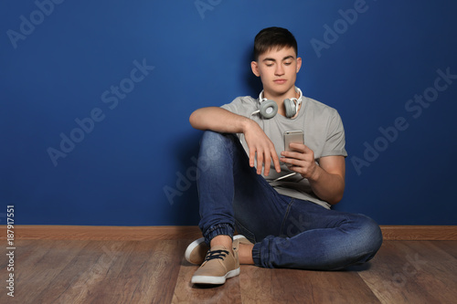 Teenage boy with headphones...