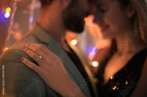 Photography Happy couple dancing together against blurred lights on engagement day