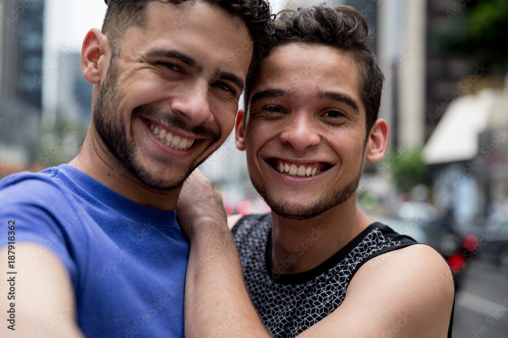 Gay Couple taking a selfie in Paulista Avenue, Sao Paulo, Brazil