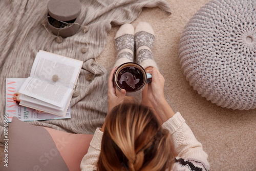 Woman relaxing with cup of ...