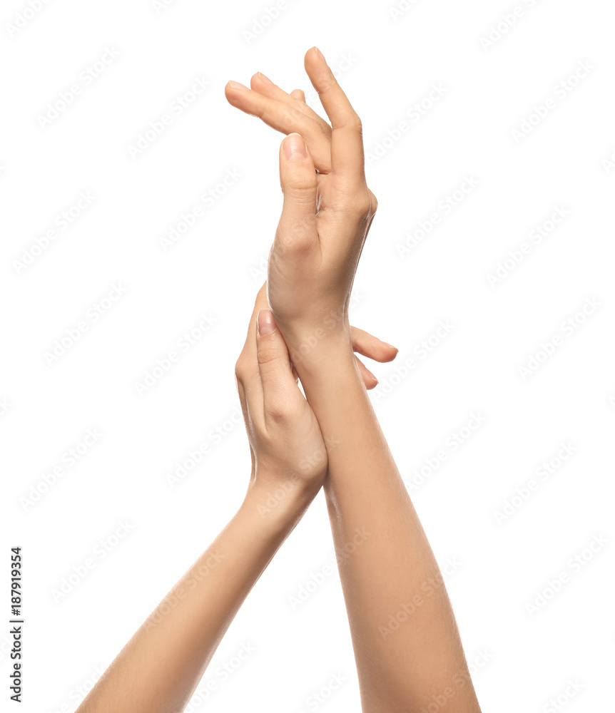 Hands of young woman with healthy skin softened by cream with moisturizing effect, on white background Hands of young woman with healthy skin softened by cream with moisturizing effect, on white background