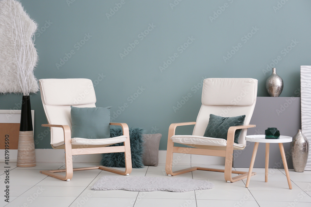 Comfortable armchairs in modern living room Comfortable armchairs in modern living room