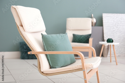 Comfortable armchair in modern living room © Africa Studio