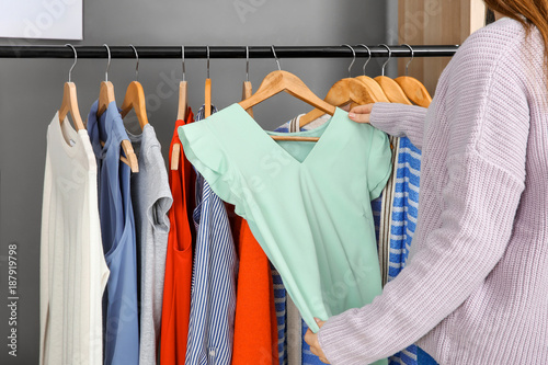 Woman choosing outfit in dressing room