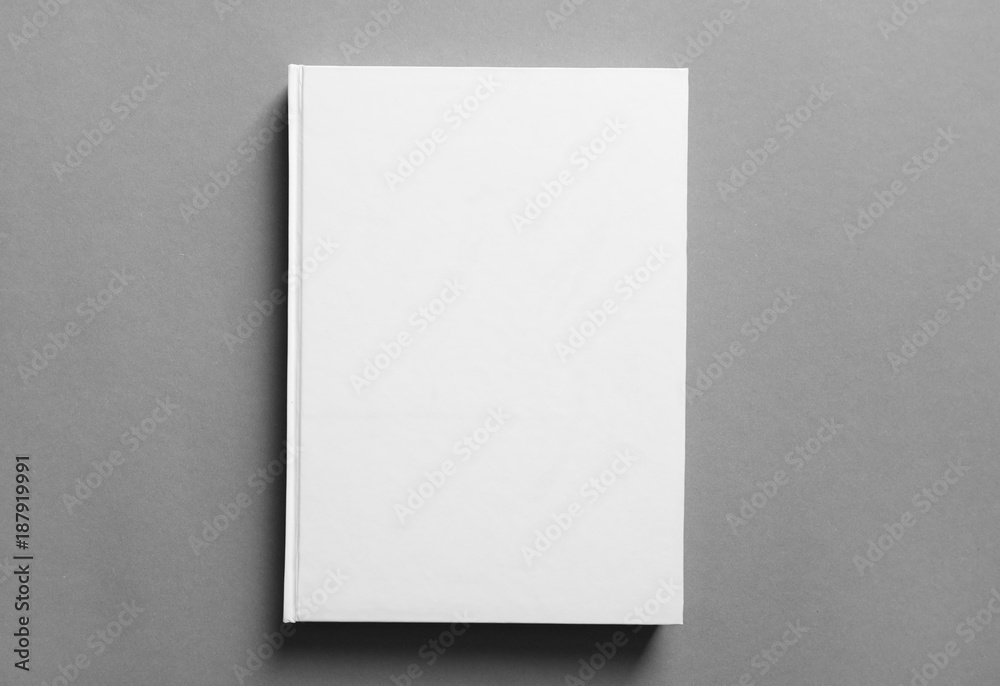 Book with blank cover on grey background. Mock up for design Book with blank cover on grey background. Mock up for design
