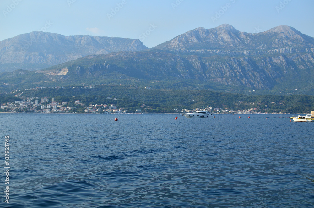 Part of beautiful Bay of Kotor with blue sea water of the Adriatic sea and hills in summertime