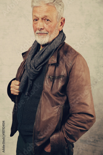 Portrait of stylish elderly bearded man wearing leather jacket. Fashion , lifestyle concept, vintage image