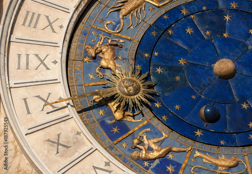 Ancient time and Astrology. Detail of Saint Mark Square renaissance Clock Tower in Venice with zodiac signs, planet and stars (15th century)