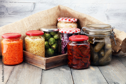Jars with variety of pickled vegetables. Preserved food