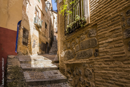Medieval cobbled and stepped street in the city of Toledo. Spain