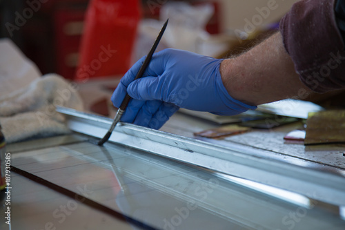 Wallpaper Mural Male hand moving paint brush glass ruler Torontodigital.ca