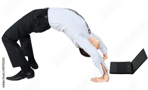 Businessman Doing Yoga and Using Laptop - Isolated