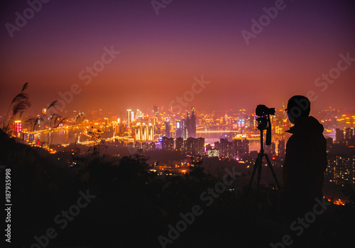 Wallpaper Mural photographer working on photo shoot  of city night scene Torontodigital.ca