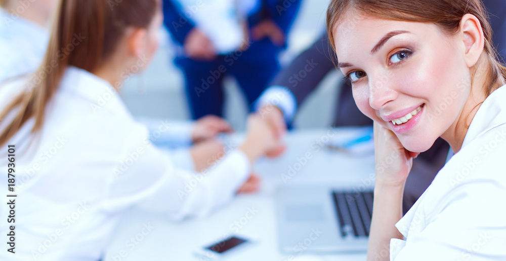 Business people shaking hands, finishing up a meeting, in office Business people shaking hands, finishing up a meeting, in office